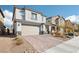 Beautiful two-story home with brick driveway, desert landscaping, and attached two car garage at 6844 Bayou Hollow Ave, Las Vegas, NV 89156