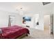 This spacious main bedroom is naturally lit and features neutral carpet and ensuite entry to the bathroom at 6844 Bayou Hollow Ave, Las Vegas, NV 89156