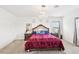 Main bedroom featuring a large bed with decorative headboard and modern hanging lighting at 6844 Bayou Hollow Ave, Las Vegas, NV 89156