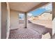 This covered patio features a brick base and provides an enjoyable outdoor space at 6844 Bayou Hollow Ave, Las Vegas, NV 89156
