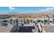Wide aerial view of a neighborhood featuring similar three-story homes under a clear blue sky at 8144 Monsoon Bay St, Las Vegas, NV 89113
