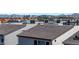 View of neighborhood with rooftop decks and Las Vegas skyline in the background at 8144 Monsoon Bay St, Las Vegas, NV 89113