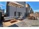 Spacious backyard with patio area, offering ample space for outdoor living and entertaining with modern patio furniture at 8144 Monsoon Bay St, Las Vegas, NV 89113