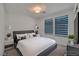This modern bedroom features a comfortable bed, stylish decor, and plenty of natural light at 8144 Monsoon Bay St, Las Vegas, NV 89113