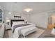 Bright bedroom featuring a comfy king bed, bench, and sleek modern design at 8144 Monsoon Bay St, Las Vegas, NV 89113