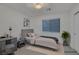 Cozy bedroom with neutral tones, a comfortable bed, and ample natural light for a relaxing retreat at 8144 Monsoon Bay St, Las Vegas, NV 89113