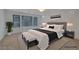 This spacious bedroom features a comfortable bed, stylish decor, and plenty of natural light at 8144 Monsoon Bay St, Las Vegas, NV 89113