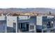 Modern home exterior with large windows and a balcony at 8144 Monsoon Bay St, Las Vegas, NV 89113
