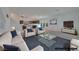 Spacious living room featuring modern furnishings, neutral tones, and an open layout for easy entertaining at 8144 Monsoon Bay St, Las Vegas, NV 89113