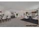 Open-concept living space with dining area, stairs, and a modern design, offering ample room for entertaining at 8144 Monsoon Bay St, Las Vegas, NV 89113