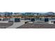 Rooftop view showcases the city skyline beyond the community of contemporary homes with private balconies at 8144 Monsoon Bay St, Las Vegas, NV 89113