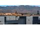 Mountain view from the rooftop of a home. City skyline, businesses and roof top patios in view at 8144 Monsoon Bay St, Las Vegas, NV 89113