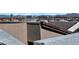 Rooftop view of the Las Vegas skyline in the distance above the roofs of this residential community at 8144 Monsoon Bay St, Las Vegas, NV 89113