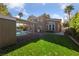 Beautiful two-story home boasts a private pool, covered patio, and manicured lawn at 8904 Saint Pierre Dr, Las Vegas, NV 89134