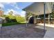 Paver patio with covered area, shed, and neatly trimmed hedge offer backyard privacy at 8904 Saint Pierre Dr, Las Vegas, NV 89134