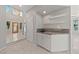 This bar area is located off of the foyer and features a marble countertop and storage at 8904 Saint Pierre Dr, Las Vegas, NV 89134