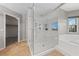 Updated bathroom featuring a glass enclosed shower, separate tub, and tile flooring at 8904 Saint Pierre Dr, Las Vegas, NV 89134