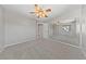 Comfortable bedroom with neutral carpet, a fan, and a mirrored closet at 8904 Saint Pierre Dr, Las Vegas, NV 89134