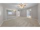 Bedroom features carpet, ceiling fan, and sliding mirror closet doors at 8904 Saint Pierre Dr, Las Vegas, NV 89134