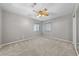 Bedroom featuring carpet, a ceiling fan, and windows with blinds at 8904 Saint Pierre Dr, Las Vegas, NV 89134