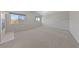 Large bedroom featuring neutral-colored walls, carpet and two windows to let in natural light at 8904 Saint Pierre Dr, Las Vegas, NV 89134