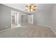 Bedroom with carpet, a ceiling fan, closet doors, and hall access at 8904 Saint Pierre Dr, Las Vegas, NV 89134