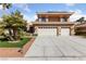 Charming home featuring a three-car garage, well-maintained landscaping, and a welcoming entrance at 8904 Saint Pierre Dr, Las Vegas, NV 89134