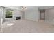 Bright living room with a fireplace, ceiling fan, and beautiful tile floors at 8904 Saint Pierre Dr, Las Vegas, NV 89134