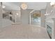 Open-concept living room with staircase, fireplace, high ceilings, and marble floors at 8904 Saint Pierre Dr, Las Vegas, NV 89134