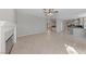 Large living room with a fireplace, tile floors, and easy access to other parts of the home at 8904 Saint Pierre Dr, Las Vegas, NV 89134