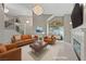 Bright living room with modern furnishings, fireplace, and high ceilings, virtually staged at 8904 Saint Pierre Dr, Las Vegas, NV 89134