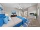 Spacious bedroom with vaulted ceilings, fireplace, and a view to the ensuite bathroom, virtually staged at 8904 Saint Pierre Dr, Las Vegas, NV 89134