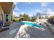 Sparkling pool with a spa, covered patio, and lush landscaping at 8904 Saint Pierre Dr, Las Vegas, NV 89134