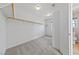 Spacious walk-in closet with custom shelving and neutral colored carpet at 8904 Saint Pierre Dr, Las Vegas, NV 89134