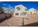 Backyard with minimal rock landscaping, privacy fence and back of home at 9257 Harbor Stream Ave, Las Vegas, NV 89149