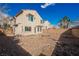 View of a backyard featuring a rock landscape, privacy fence and a lovely view of the home at 9257 Harbor Stream Ave, Las Vegas, NV 89149