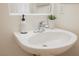 Bathroom sink with stylish faucet, decor and updated lighting at 9257 Harbor Stream Ave, Las Vegas, NV 89149