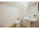 Bathroom with pedestal sink, tile floors and good lighting at 9257 Harbor Stream Ave, Las Vegas, NV 89149