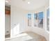 Bright room featuring tiled floors, neutral walls, and many windows for tons of light at 9257 Harbor Stream Ave, Las Vegas, NV 89149