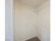 A walk-in closet with white walls, carpet, and wire shelving for efficient storage at 9257 Harbor Stream Ave, Las Vegas, NV 89149