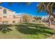 Community Park with large grassy lawn, mature shade trees and an inviting bench seating area at 9257 Harbor Stream Ave, Las Vegas, NV 89149
