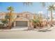 Charming two-story home features a well-maintained front yard and attached two-car garage at 9257 Harbor Stream Ave, Las Vegas, NV 89149