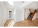 Bright and airy foyer with tiled flooring and staircase leading to the second floor at 9257 Harbor Stream Ave, Las Vegas, NV 89149