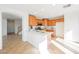 Bright kitchen with an island, wooden cabinets, and modern appliances at 9257 Harbor Stream Ave, Las Vegas, NV 89149