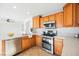 Kitchen featuring quartz countertops and stainless steel double oven at 9257 Harbor Stream Ave, Las Vegas, NV 89149