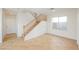 Comfortable open living space featuring a staircase and a large window at 9257 Harbor Stream Ave, Las Vegas, NV 89149