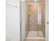 Walk-in tiled shower with glass enclosure in the bathroom at 9257 Harbor Stream Ave, Las Vegas, NV 89149