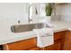 Close up of kitchen sink with quartz countertop and modern faucet at 9257 Harbor Stream Ave, Las Vegas, NV 89149