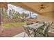 Relaxing backyard with covered patio area, lush lawn, and well-maintained landscaping at 1009 Rustridge Ave, North Las Vegas, NV 89081