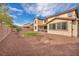 Expansive backyard showcasing a well-manicured lawn, private patio, and mature landscaping at 1009 Rustridge Ave, North Las Vegas, NV 89081